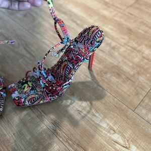 Multi colored sandal with red heel. About a 3.5 inch heel. Comfortable